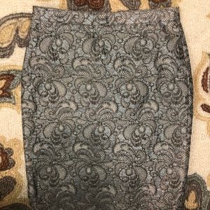 Silver detailed back zippered skirt.